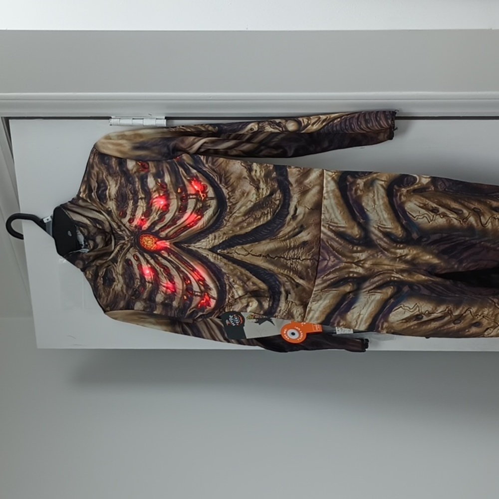 NWT KIDS MOTION ACTIVATED LIGHT UP AND SOUND SKELETON DRAGON COSTUME